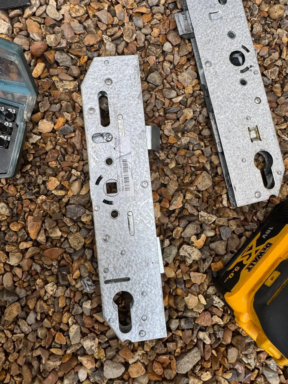 Locksmith repairing a uPVC door gearbox and locking mechanism