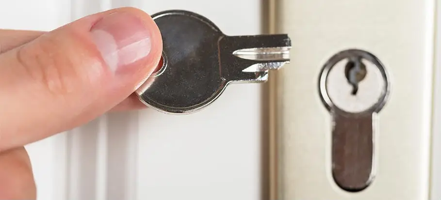 Broken key being removed from a door lock by Lock & Key Locksmiths